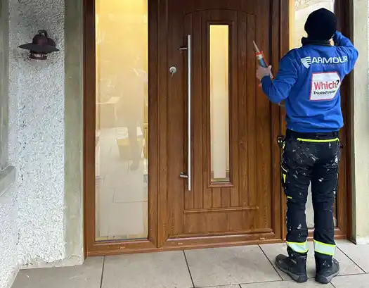 Worker installing door